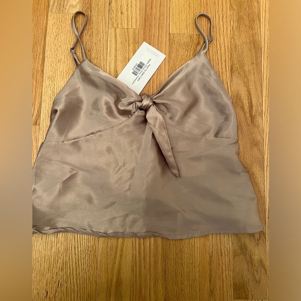 Satin champagne colored cropped top with tie. Size Small w adjustable straps.